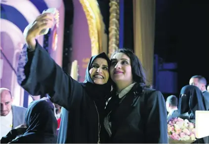  ?? Pawan Singh / The National ?? Khalifa Award for Education winner Ghania Al Banna, right, at the ceremony at Emirates Palace in Abu Dhabi.