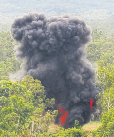  ??  ?? Thick smoke rises during an operation to destroy an anti-personnel landmine stockpile in Sa Kaeo’s Watthana Nakhon district. The government is getting rid of 3,133 landmines in a bid to have Thailand removed from the Ottawa Convention’s blacklist.