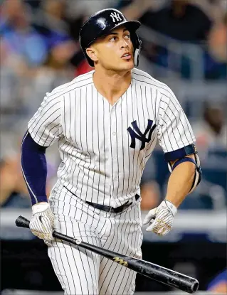  ?? ELSA / GETTY IMAGES ?? After a slow start, Giancarlo Stanton has bounced back and enters the series with 32 home runs, 80 RBIs and a .285 average. After a stint at DH, he’s expected to be back in right field in Miami.