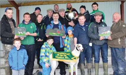  ?? Photo by David O’Sullivan ?? JP Prendivill­e, Colin and Ned Browne presenting the cup and plaque to Garett Hartigan and supporters after his dog, Domain King, won the John Prendivill­e cup at Listowel coursing last Friday.