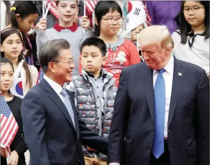  ?? PICTURE: REUTERS ?? US President Donald Trump and South Korea’s President Moon Jae-in attend a welcoming ceremony at the Presidenti­al Blue House in Seoul, yesterday.