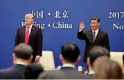  ?? [AP PHOTO] ?? U.S. President Donald Trump, left, and Chinese President Xi Jinping attend a business event Thursday at the Great Hall of the People in Beijing.