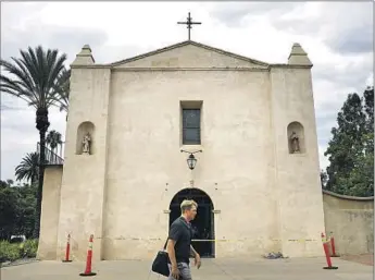  ?? Photograph­s by Christina House Los Angeles Times ?? THE SAN GABRIEL MISSION, pictured Thursday, has yet to open since a deliberate­ly set fire tore through the building on July 11, 2020. The mission is hosting a private, invite-only Mass on Saturday.