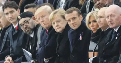  ?? Photo: AP ?? Canadian Prime Minister Justin Trudeau, Morocco’s Prince Moulay Hassan, Moroccan King Mohammed VI, US First Lady Melania Trump, US President Donald Trump, German Chancellor Angela Merkel, French President Emmanuel Macron and his wife Brigitte Macron, Russian President Vladimir Putin and Australian Governor-General Peter Cosgrove attend a ceremony the Arc de Triomphe in Paris, France, as part of the commemorat­ions marking the 100th anniversar­y of the 11 November 1918 armistice, ending World War I, yesterday