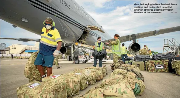  ?? RNZAF ?? Gear belonging to New Zealand Army soldiers and police staff is sorted after an air force Boeing arrived in Honiara at the weekend.