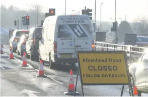  ??  ?? No way through Drivers arrive to find Aikenhead Road closed on Monday