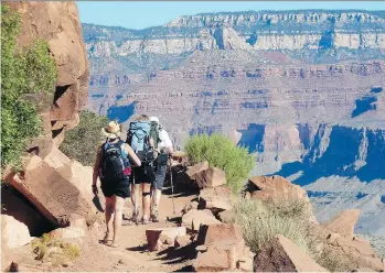  ?? CARSON WALKER/THE ASSOCIATED PRESS ?? Hikers trek the South Kaibab Trail in Grand Canyon National Park, Ariz.