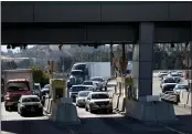  ?? ANDA CHU — STAFF ARCHIVES ?? Traffic stacks up as cars pass through the BeniciaMar­tinez Bridge Toll Plaza cash lanes in Martinez on Oct. 3.