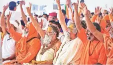  ?? PTI ?? Priests at a BJP rally in Rishikesh.