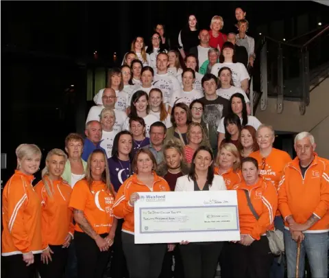  ??  ?? Organisers and participan­ts of Relay for Life Wexford present the cheque for €20,000 to Eileen Kearney of the Irish Cancer Society.