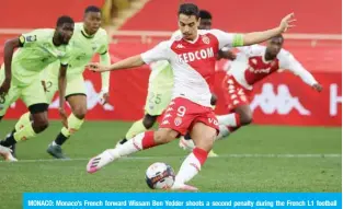  ??  ?? MONACO: Monaco’s French forward Wissam Ben Yedder shoots a second penalty during the French L1 football match between AS Monaco and Dijon at “Louis II” stadium in Monaco on Sunday. —AFP