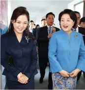  ?? (AFP) ?? Kim Jung-sook (right), wife of Moon Jae-in, with Ri Sol Ju, wife of Kim Jong-un, in Pyongyang on Tuesday