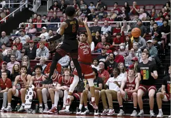  ?? NIC COURY – THE ASSOCIATED PRESS ?? USC guard Bronny James swats the ball away from Stanford guard Josue Gil-Silva during their Feb. 10 Pac-12 game.