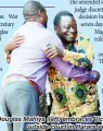  ??  ?? Douglas Mahiya (left) embraces Victor Matemadand­a outside court in Harare yesterday