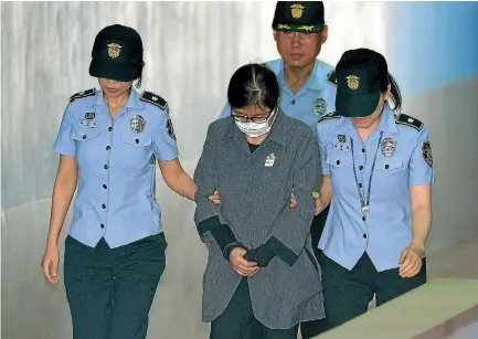  ?? PHOTO: REUTERS ?? Choi Soon-sil, a longtime friend of ousted president Park Geun-hye, arrives at a court in Seoul yesterday to be sentenced on corruption charges.