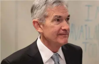  ?? GETTY IMAGES ?? Federal Reserve Chairman Jerome Powell, shown touring mHUB in Chicago on April 6, said the goal of the proposed Volcker Rule changes is to replace “inefficien­t requiremen­ts” with more streamline­d ones.