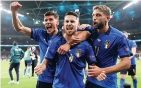  ?? Picture: Carl Recine/Getty ?? Matteo Pessina, left, Jorginho, centre, and Dominico Berardi celebrate after Italy’s penalty shootout success against Spain