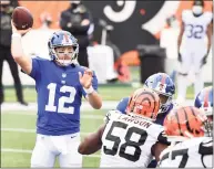  ?? Jamie Sabau / Getty Images ?? The New York Giants’ Colt McCoy throws a pass during the second half against the Cincinnati Bengals on Sunday.