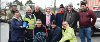  ??  ?? Rathmore residents Janine Jackson, Anthony Murphy, Seamus McCarthy, Brian Kelly (back from left) Anthony Martin, Matt Hegarty, Denis Desmond, Joan Heapes, Paul Ryan, Sean Casey and Michael O’Mahony putting up the Christmas lights in Rathmore. Photo by...