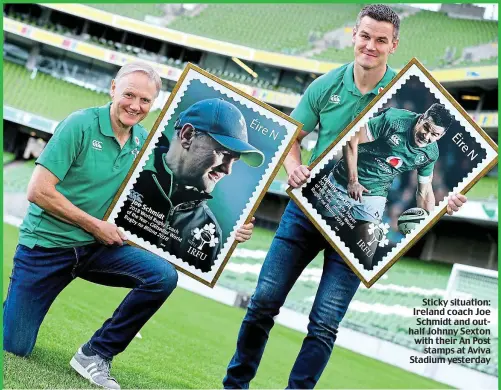  ??  ?? Sticky situation: Ireland coach Joe Schmidt and outhalf Johnny Sexton with their An Post stamps at Aviva Stadium yesterday