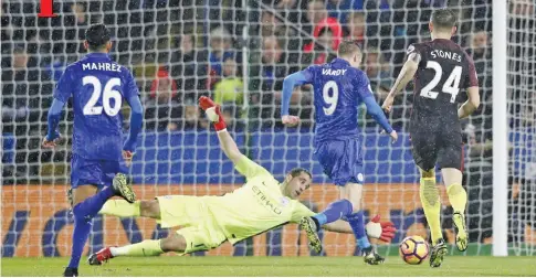  ??  ?? LEICESTER: Leicester City’s English striker Jamie Vardy (2nd R) takes the ball around Manchester City’s Chilean goalkeeper Claudio Bravo on his way to scoring their third goal during the English Premier League football match between Leicester City and...