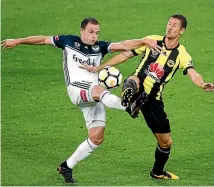  ?? PHOTO: GETTY IMAGES ?? Leigh Broxham (Melbourne Victory, left) and Nathan Burns (Phoenix) vie for possession during the A League match in Wellington on Wednesday night.