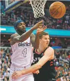  ?? NICK WASS THE ASSOCIATED PRESS ?? Less than three weeks ago, Wizards guard Ty Lawson, left, was playing profession­al basketball in China. Nowadays, he’s been one of the first subs off the bench for Washington in the Wizards’ Eastern Conference firstround playoff series against the No....