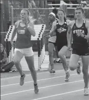  ?? MIKE BUSH/NEWS-SENTINEL ?? Lodi's Paige Sefried, left, battles with Vista del Lago's Emily Costello down the stretch of the 400 at the SacJoaquin Section Masters Meet at Elk Grove High on May 25.