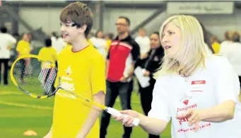  ?? COREY LEBLANC/SPECIAL TO POSTMEDIA NETWORK ?? Canadian Olympian and five-time Pan Am Games medallists Charmaine Reid, right, shares some badminton tips with students from three elementary schools in Niagara at Jumpstart Games Thursday in Welland.