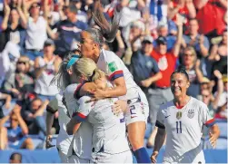  ?? ALESSANDRA TARANTINO/ASSOCIATED PRESS ?? U.S. players celebrate after teammate Julie Ertz scored the team's second goal during Sunday's victory against Chile.