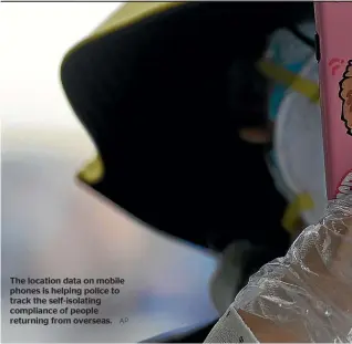  ?? AP ?? The location data on mobile phones is helping police to track the self-isolating compliance of people returning from overseas.