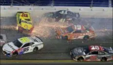  ?? RON SANDER — THE ASSOCIATED PRESS ?? Joey Logano (22) hits the wall as he is involved in a multicar crash also involving Kasey Kahne (95), Kurt Busch (41), Daniel Suarez (19), Erik Jones (20) and others during the NASCAR Cup Series auto race at Daytona Internatio­nal Speedway, Saturday in...