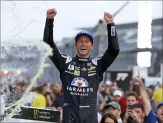  ?? THE ASSOCIATED PRESS ?? Kasey Kahne (5) celebrates winning the NASCAR Brickyard 400 auto race at Indianapol­is Motor Speedway last year.