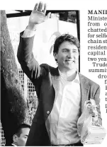  ??  ?? Trudeau waves to residents after he ordered food at a Jollibee fast food restaurant in Tondo city, metro Manila, Philippine­s. — Reuters photo