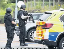  ??  ?? PATROL Police at Gleneagles railway station car park after the raid