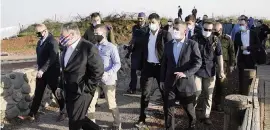  ?? PATRICK SEMANSKY AP ?? Secretary of State Mike Pompeo, second from left, arrives for a security briefing on Mount Bental in the Israeli-controlled Golan Heights, near the Israeli-Syrian border, Thursday.