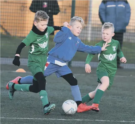  ??  ?? Easington Colliery Whites (green) in action against Boldon Colts.