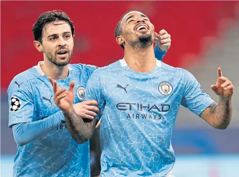  ??  ?? WINNING INGREDIENT­S: Manchester City goalscorer­s Bernardo Silva, left, and Gabriel Jesus celebrate last night.