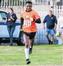  ?? Picture: DEAN VENISH ?? GREAT RUN: Lucky Maahlo of Pietersbur­g Road Runners on his way to crossing the finish line at the end of the annual Washie 100 at the Buffalo Club on Saturday morning.