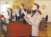  ?? Abraham / Hearst Connecticu­t Media ?? Christian
Gov. Ned Lamont looks on as Mayor Joe Ganim speaks during a visit to The Jewish Home senior services facility on Park Avenue in Bridgeport on May 15.