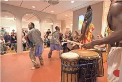  ?? FRONTROOM PHOTOGRAPH­Y ?? Ko-Thi Dance Company performs around the lakou in the Milwaukee Art Museum's gallery of Haitian art.