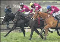  ??  ?? FINISH Dounikos (blue cap) gets up to lead Gigginstow­n 1-2-3