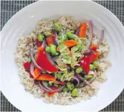  ??  ?? Top the grain with a generous amount of vegetables. In this case they were stir-fried.