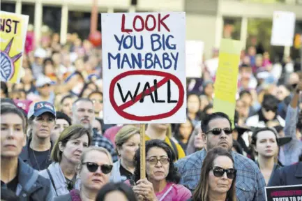  ??  ?? Protesters hold signs during the Women’s March on January 19, 2019 in Los Angeles, California.