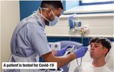  ??  ?? A patient is tested for Covid-19