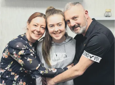  ??  ?? Kayleigh Llewellyn with parents Sonia Llewellyn and Shaun Sidney. Below, Kayleigh wearing the ring that belonged to her heart donor.