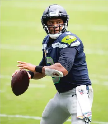  ?? AP ?? Seahawks QB Russell Wilson tied Peyton Manning’s record with 16 touchdown passes in the first four games.