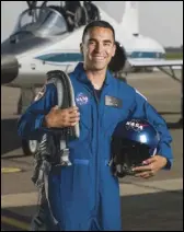  ??  ?? NASA astronaut candidates Raja Chari (left) and Bob Hines (right) were among 13 new astronauts who graduated Friday.