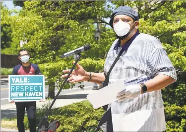  ?? Arnold Gold / Hearst Connecticu­t Media ?? The Rev. Scott Marks, director of New Haven Rising, speaks at a protest rally to demand that Yale University and Yale New Haven Hospital make up the revenue lost due to their tax-exempt status in front of Yale University’s Sheffield-Sterling-Strathcona Hall in New Haven on Tuesday.