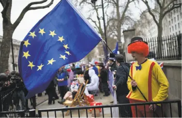  ?? Oli Scarff / AFP / Getty Images ?? Anti-Brexit protesters demonstrat­e in London, after Britain began the process of withdrawal from the EU.